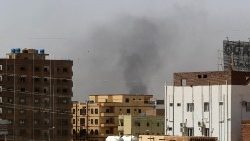 Smoke rises above buildings in Khartoum on April 15, 2023, amid reported clashes in the city