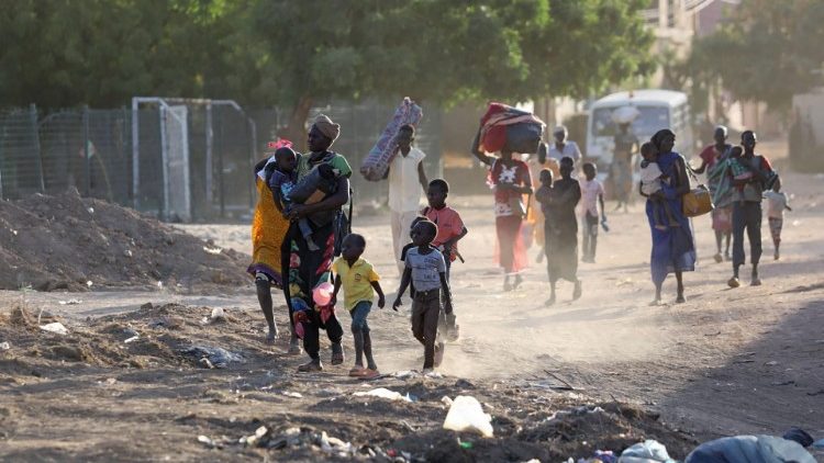 People flee their neighbourhoods amid fighting in Khartoum following the collapse of a 24-hour truce