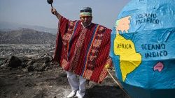 A Peruvian shaman takes part in a ritual to deliver predictions for the upcoming Earth Day, on top of the San Cristobal hill in Lima