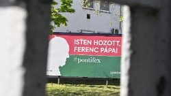 A siluette of Pope Francis is seen on a billboard with a text Welcome Pope Francis� in the 13th district of Budapest. (Photo by Attila KISBENEDEK / AFP)