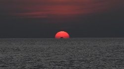 The sun sets over the Sulu sea in the Philippines. 