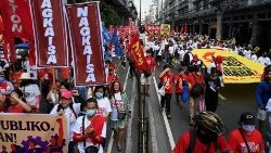 Demonstrators take part in a Labor Day rally in Manila on 1 May 2023.