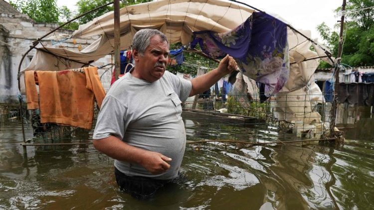 Ukrainian farmer stands chest-deep in water following destruction of Kakhovka dam