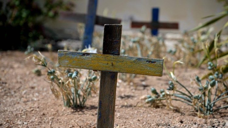 Wooden crosses made with the remains of boats in Lampedusa commemorate migrants who have died at sea during their journeys of hope