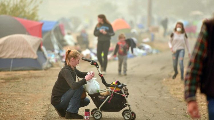 A mother and child displaced by wildfires in California