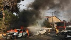 Firefighters douse a car blaze in Ashkelon