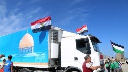 Trucks carrying aid enter the Rafah border crossing from Egypt into Gaza
