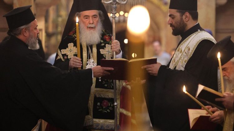 Greek Orthodox Patriarch Theophilos III leads a prayer for peace