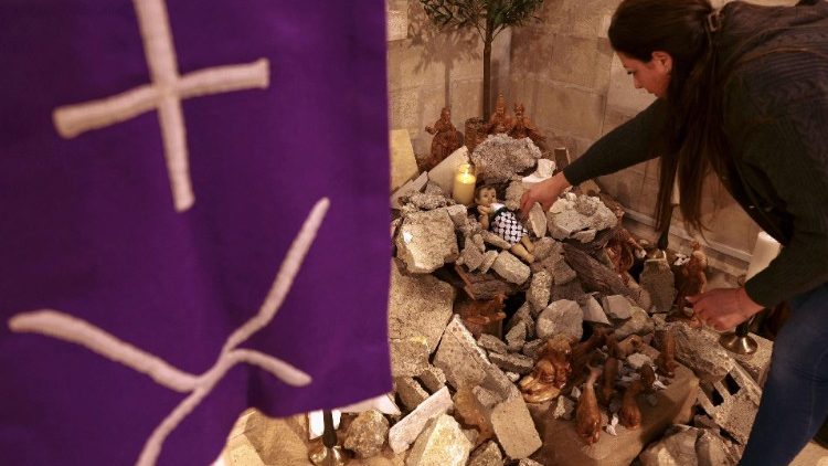 A woman sets up a Nativity Scene in Bethlehem