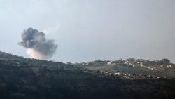 Smoke billowing above the Lebanese village of Hula during Israeli bombardment.