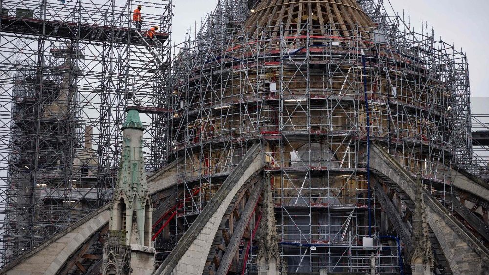 Workers rebuild the Cathedral's spire