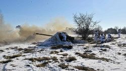 Ukrainian servicemen fire an anti-tank gun