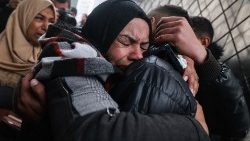 Palestinians mourn relatives killed in overnight Israeli bombardment in Rafah, southern Gaza Strip