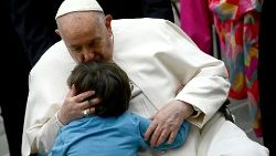File photo of Pope Francis with a child during a General Audience