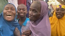 Women react as abducted children are reunited with their families in Auriga, Nigeria