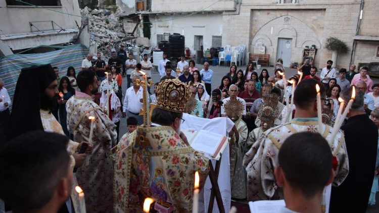 Orthodox Christians celebrate the Divine Liturgy for Easter outside the church of St Porphyrius in Gaza City