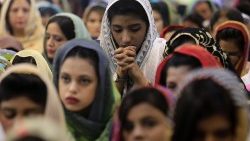 Pakistani Christian women pray at Mass in Peshawar