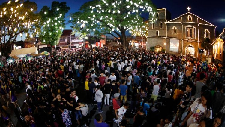 Philippine Catholics attending traditional dawn mass ahead of Christmas.