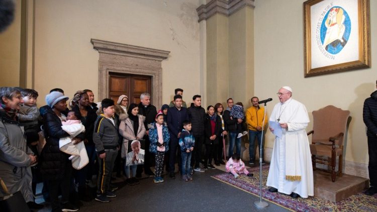Pope Francis with refugees from Lesbos island of Greece