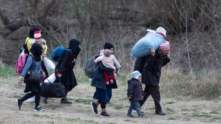 Syrian refugee family on border between Turkey and Greece