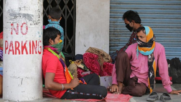 Migrants workers from Chattisgarh sit near the railway station during lockdown, India
