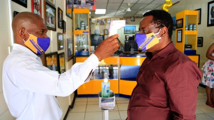 Shopper has temperature checked in a shop in Harare, Zimbabwe