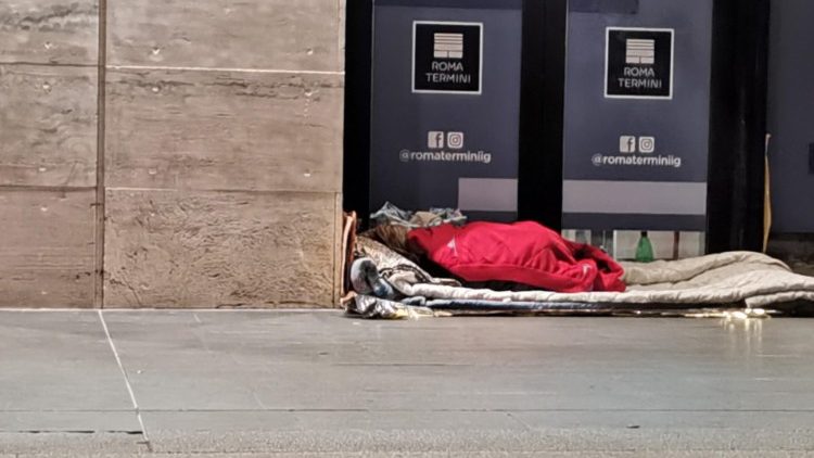 A homeless person sleeps rough near Rome's main train station