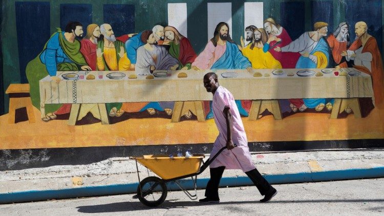 A man walks in front of a mural copying "The Last Supper" in Port-au-Prince, Haiti (file photo)