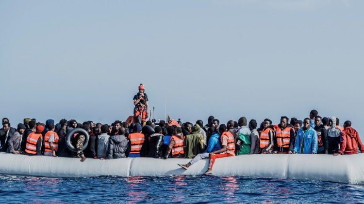 Migrants in a rubber boat attempting to cross the Mediterranean to reach Europe