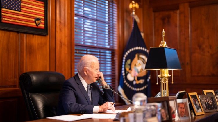 US President Joe Biden speaking on the phone with Russian President Vladimir Putin