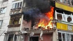 A house burns in Ukraine's Luhansk region after Russian shelling