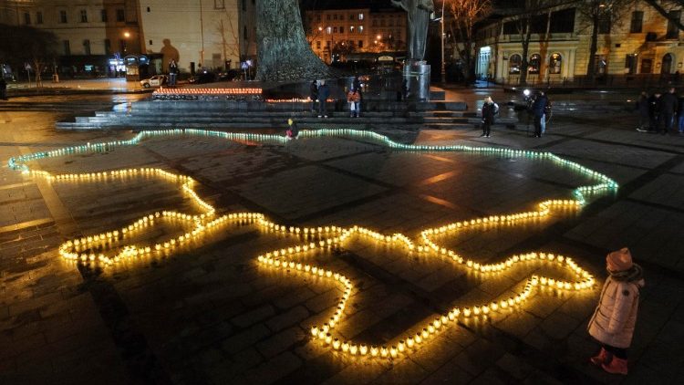 Map of Ukraine lit by candles