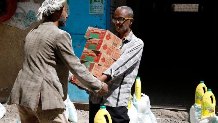 Conflict affected people in Yemen receive emergency food rations