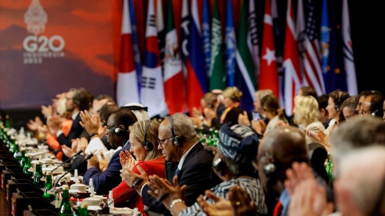 Delegates applaud during the handover ceremony at the G20 summit in Bali
