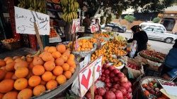 People buy fruit and vegetables in Cairo