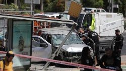 Israeli security forces investigate the site of a car ramming attack in Tel Aviv