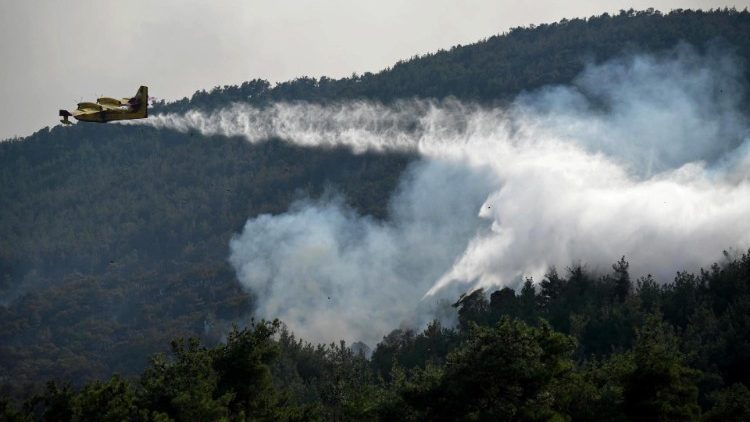 A firefighting aircraft operates during a wildfire at Dadia forest, Thrace, northern Greece