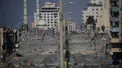 Debris in a deserted street following an Israeli air strike in Gaza City