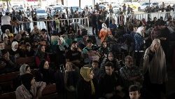 Rafah border crossing between Gaza and Egypt opens to allow limited evacuations