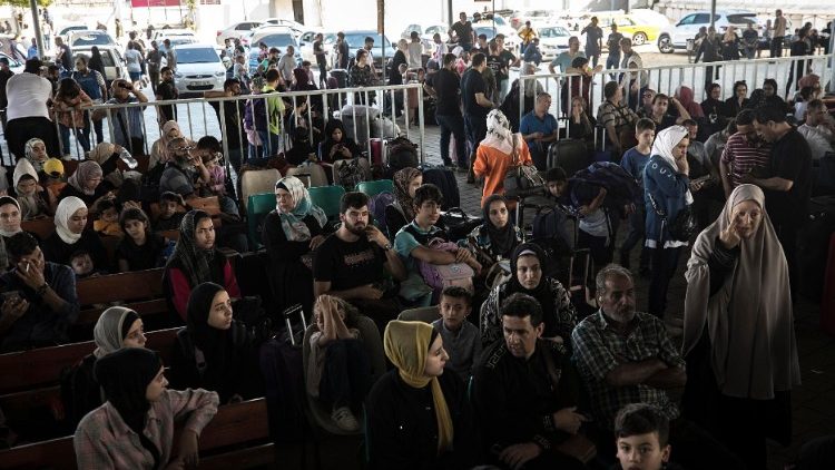 Rafah border crossing between Gaza and Egypt opens to allow limited evacuations