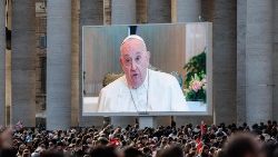 Pope Francis appears on the screens in St Peter's Square as he recites the Angelus on Sunday