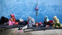 Rohingya refugees rest at a temporary shelter in Indonesia