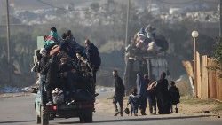 Palestinians evacuate a refugee camp as Israeli military operations in Gaza continue