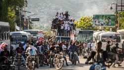Des Haïtiens défilent dans les rues de Port-au-Prince le 1er janvier 2024 en soutien au gouvernement haïtien. 