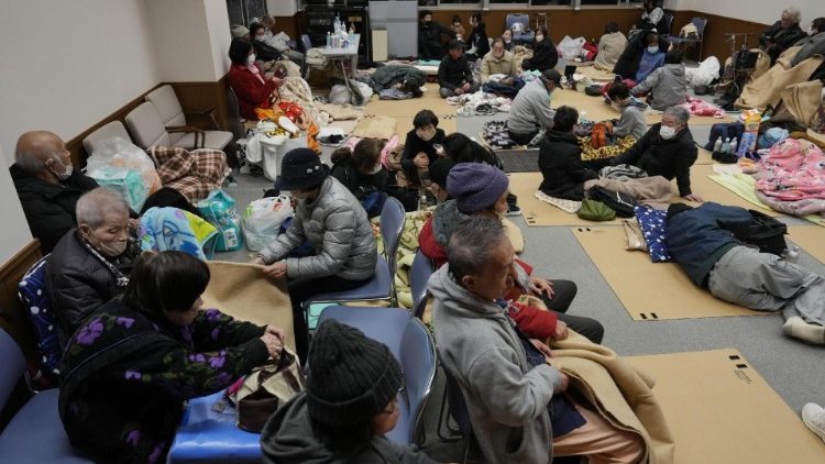 Residents rest at an evacuation shelter in Japan