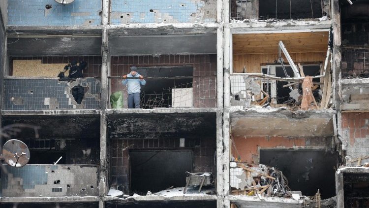 Communal workers repair damage after missile strike in Kyiv