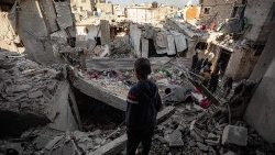 Palestinians inspect damaged areas following Israeli airstrike on Rafah, southern Gaza
