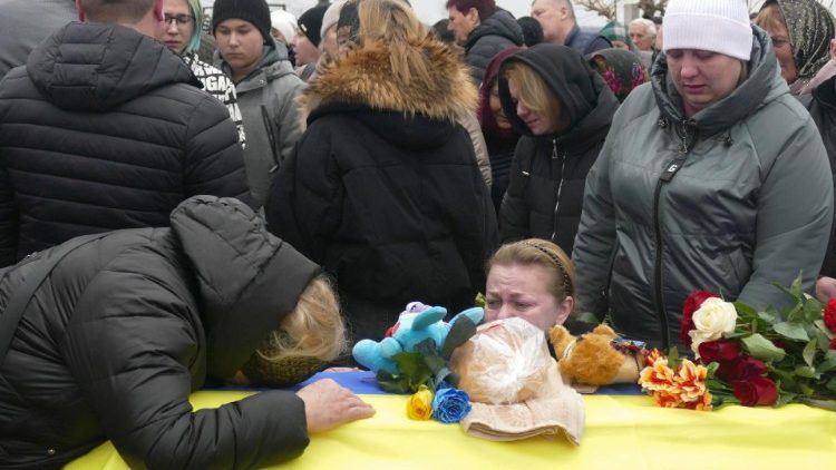 Mourners attend the funeral ceremony for the Kravets family in the Raukhovka settlement near the southern city of Odesa, Ukraine, 05 March 2024