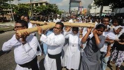 Sri Lankan priests and nuns carry the cross during Good Friday celebrations in Colombo