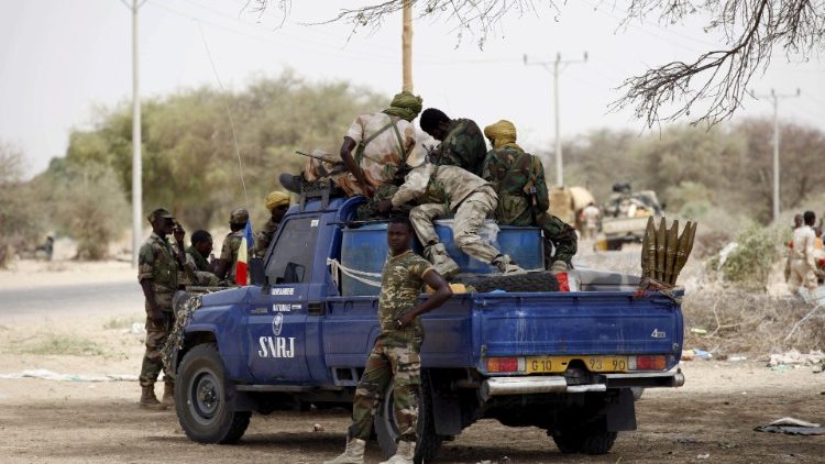 FILE PHOTO: Chadian soldiers sit in a military pickup truck in Damasak